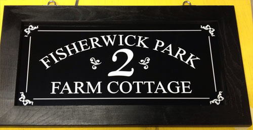 http://www.sign-maker.net/wooden-framed-hanging-signs.html