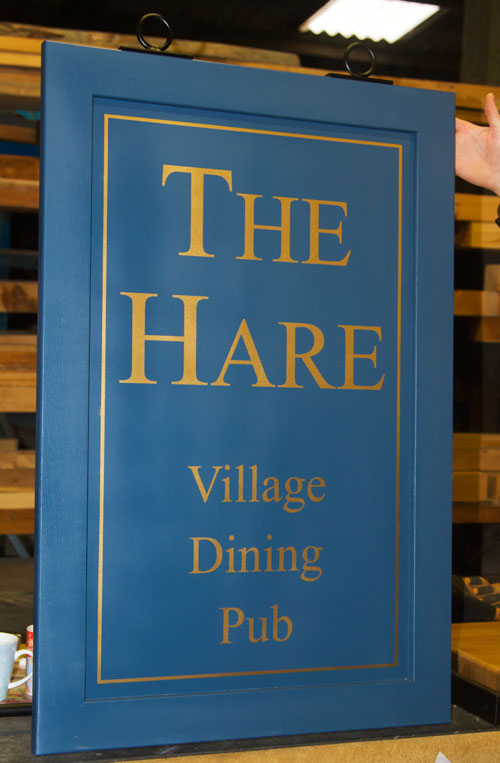Wooden framed hanging sign